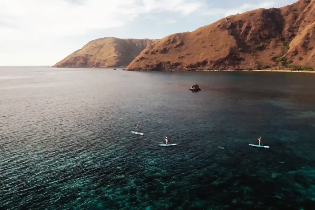 Paddleboarding from a family charter yacht