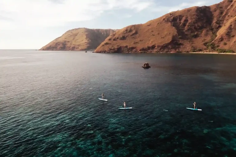 Paddleboarding from a family charter yacht